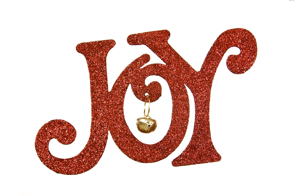 Red glitter “JOY” Christmas decoration with a small gold bell hanging inside the letter O